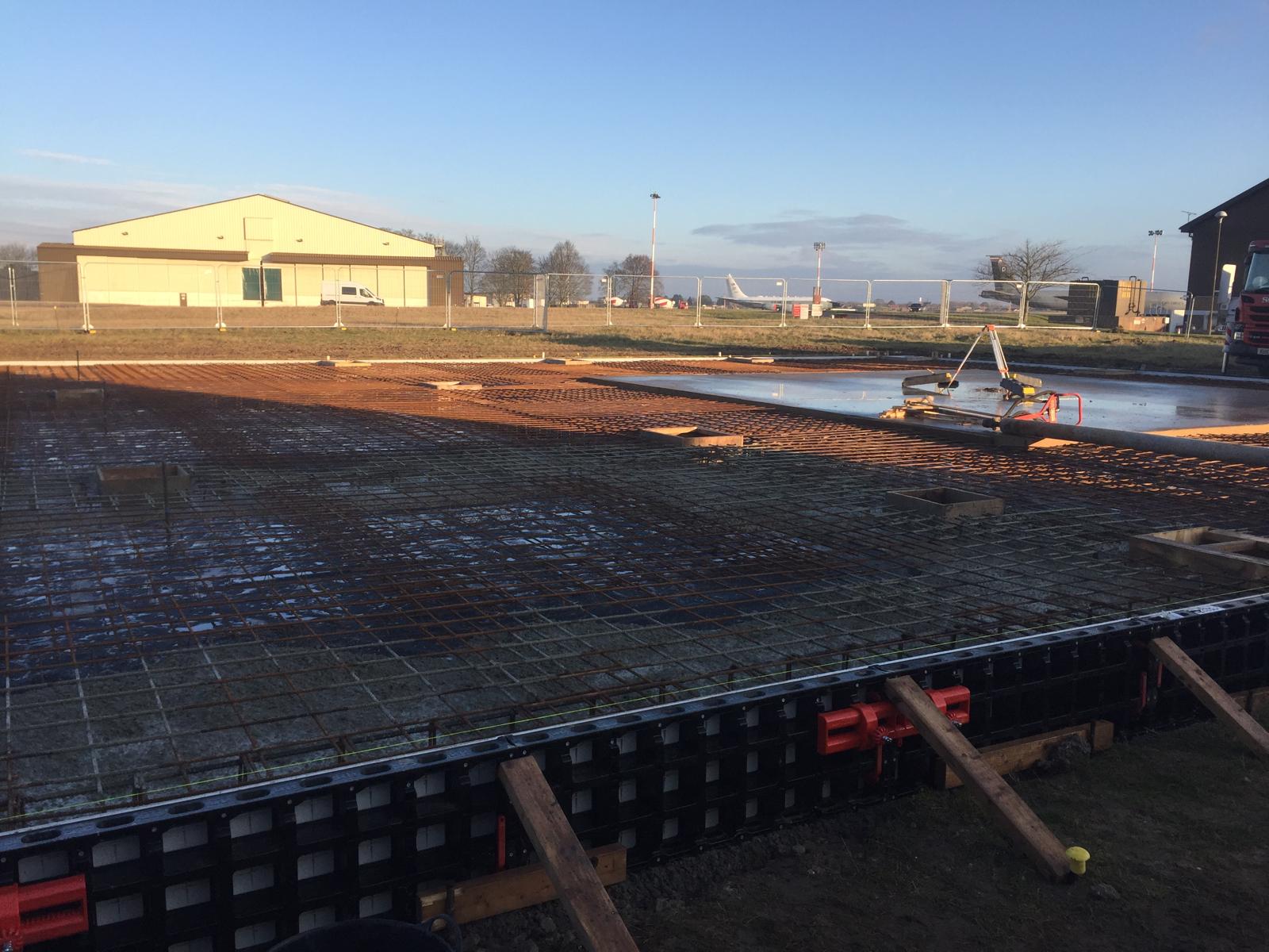 Fresh concrete laid over reinforcement mesh during the hardstanding works at RAF Mildenhall