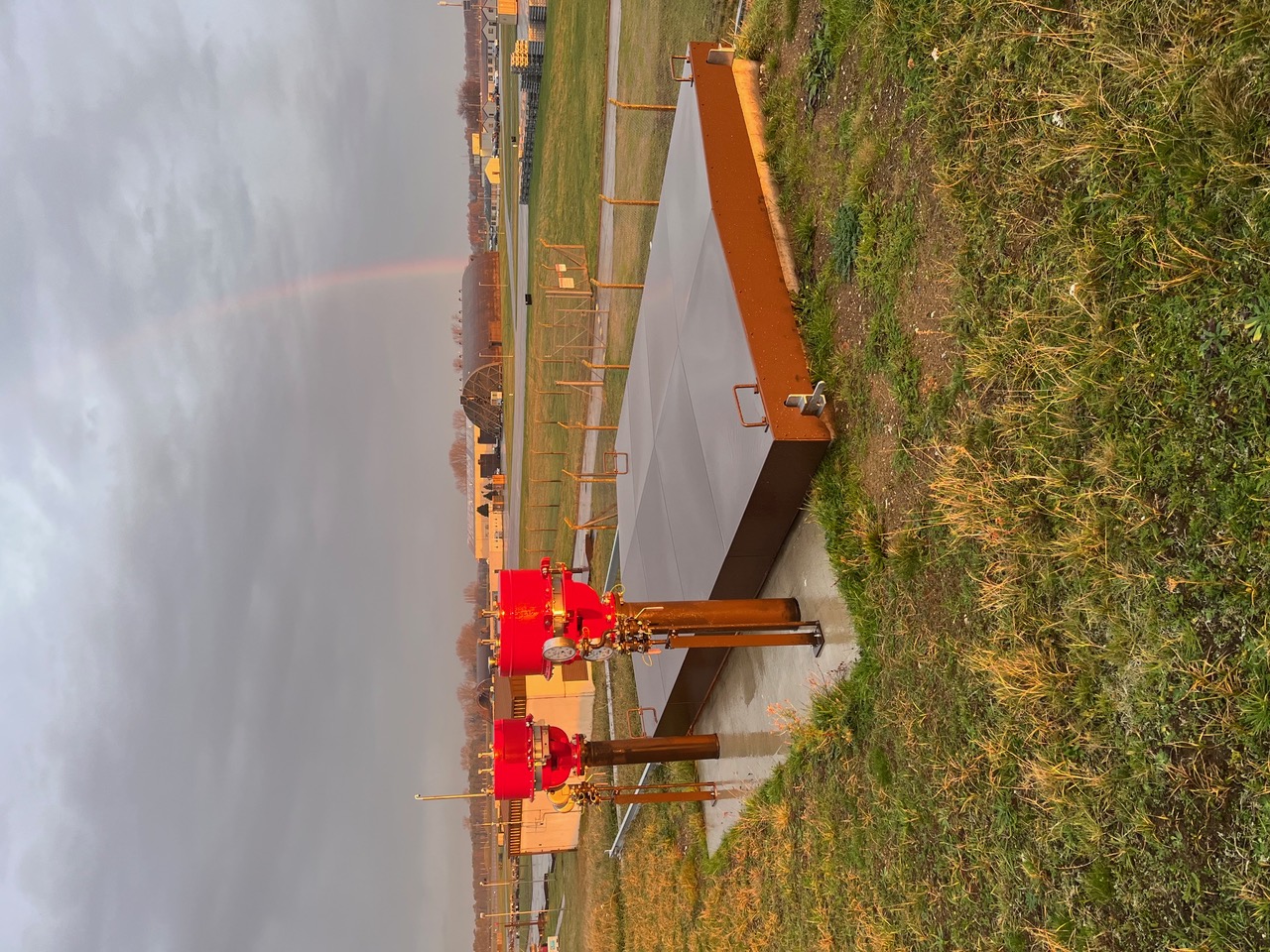Completed fuel chambers and access covers at RAF Fairford beneath a rainbow